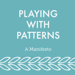 White text on a blue background with the post title "Playing With Patterns - A Manifesto" and a series of simple white leaves at the bottom below the text.